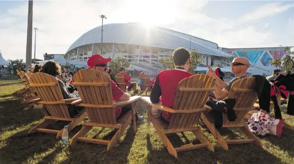  ?? ARDEN SHIBLEY/ CANADIAN OLYMPIC COMMITTEE ?? Fans lounge in Muskoka chairs outside Canada House. Generally reserved for athletes and their friends and family, it was open to all Canadians on Friday.