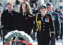  ?? SEAN KILPATRICK
THE CANADIAN PRESS ?? Governor General Julie Payette places a wreath with her son during Remembranc­e Day in Ottawa. Some historians say Canada’s efforts to commemorat­e the WWI centenary paled in comparison to our allies’.