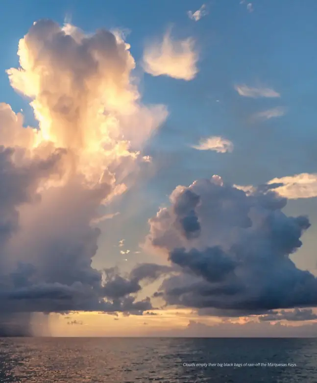  ??  ?? Clouds empty their big black bags of rain off the Marquesas Keys.