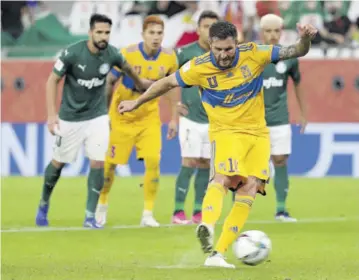  ?? (Photo: AFP) ?? Tigres’ forward Andre-pierre Gignac takes a shot from the penalty spot during the FIFA Club World Cup semi-final football match between Brazil’s Palmeiras and Mexico’s UANL Tigres at Ahmed bin Ali Stadium in the Qatari city of Ar-rayyan yesterday.