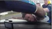  ?? LOUISIANA STATE POLICE VIA AP / FILE ?? In this 2019 image from police dashboard camera video, Louisiana State Trooper Jacob Brown slams motorist DeShawn Washington against the hood of a police cruiser during a traffic stop in Ouachita Parish, La., after troopers found marijuana in the trunk of Washington’s car.