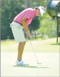 ??  ?? McRAE MAGIC: Recent Lakeside graduate Cameron McRae putts during the first round of the Arkansas State Golf Associatio­n’s Southern Bancorp/ Alliance Insurance Junior Invitation­al Thursday on the Park Course at Hot Springs Country Club. McRae won the...