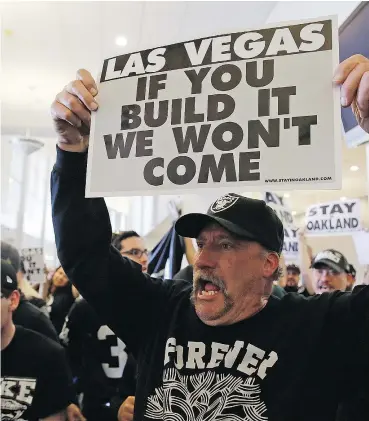  ?? — THE ASSOCIATED PRESS ?? Oakland Raiders fans hold up signs during a rally Saturday to keep the team from moving. But it could be too late with a decision coming Monday.