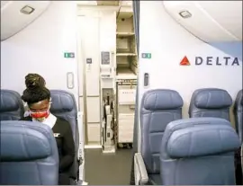  ?? John Minchillo Associated Press ?? MORE THAN 900 passengers have been banned for refusing to wear a mask on Delta, United and Alaska. Such behavior would increase the risks for others.