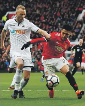  ?? Reuters ?? Alexis Sanchez, right, struck again for Manchester United, adding the team’s second goal in yesterday’s 2-0 win over Swansea City at Old Trafford