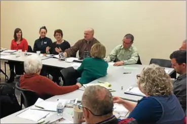  ?? TAWANA ROBERTS — THE NEWS-HERALD ?? Community business owners and leaders met on March 13 for the monthly Downtown Painesvill­e Organizati­on merchant meeting at Morley Library.