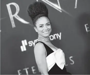  ?? VALERIE MACON/GETTY-AFP ?? Actor Lauren Ridloff arrives for the Oct. 18 premiere of Marvel Studios’“Eternals” in Los Angeles. In the film, Ridloff plays Makkari, a cosmic being known for her superhuman speed who is also the franchise’s first deaf superhero.