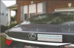  ?? (AP/Jessie Wardarski) ?? A sticker reading “Just ask a Muslim US Marine” sits on the back of Mansoor Shams’ vehicle at his home in Baltimore, on Aug. 13. Shams, who served in the Marines from 2000 to 2004, was called names like “Taliban,” “terrorist” and “Osama bin Laden” by some of his fellow Marines after 9/11. In recent years, Shams has used his identity as both a Muslim and a former Marine to dispel misconcept­ions about Islam.