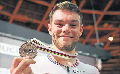  ??  ?? Great Britain’s Matt Walls proudly shows off his bronze medal in Berlin