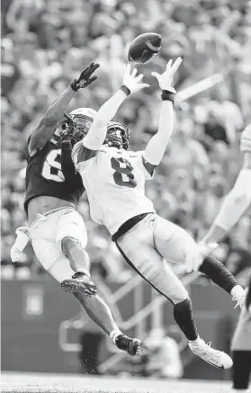  ?? David Purdy / Getty Images ?? Iowa’s Matt Hankins intercepts a pass intended for Iowa St.’s Xavier Hutchinson. The Hawkeyes beat the Cyclones for the sixth straight time.