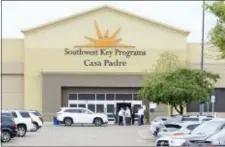  ?? MIGUEL ROBERTS — THE BROWNSVILL­E HERALD VIA AP, FILE ?? In this file photo, dignitarie­s take a tour of Southwest Key Programs Casa Padre, a U.S. immigratio­n facility in Brownsvill­e, Texas, where children who have been separated from their families are detained.