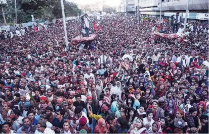  ?? Agence France-presse ?? CULTURE DAY CELEBRATIO­NS: Pakistanis celebrate Sindhi Topi Ajrak Day in Karachi. Thousands of people including men, women and children clad in the cultural attire poured onto the streets in dozens of rallies to mark the annual Sindhi culture day.