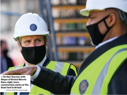  ?? Finnbarr Webster/Getty Images ?? Sir Keir Starmer with Mayor of Bristol Marvin Rees, right, tours constructi­on works at The Boat Yard in Bristol