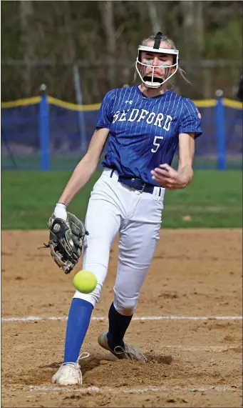  ?? STAFF PHOTO — STUART CAHILL/BOSTON HERALD ?? Bedford’s Alyx Rossi throws in the first inning during a 2-0softball victory over visiting Triton on Friday.