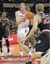  ?? ASSOCIATED PRESS FILE PHOTO ?? New Mexico’s Joe Furstinger, center, has recorded a double-double in four straight games, averaging 14.8 points, 11 rebounds and 3.3 assists with just 11 personal fouls in a 3-1 stretch against Rice, Prairie View A&M, Air Force and Nevada.