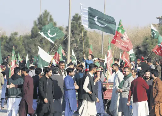  ?? ?? Supporters of the Pakistan Tehrik-e-Insaf (PTI) political party gather to protest as they allege rigging in the general elections, Peshawar, Pakistan, Feb. 13, 2024.