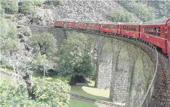  ?? RICK STEVES ?? Taking a train like Switzerlan­d’s Bernina Express keeps you close to Europe’s charms.