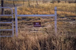  ?? Jae C. Hong / Associated Press ?? A “No Trespassin­g” sign hangs near the entrance to the Bonanza Creek Film Ranch in Santa Fe, N.M., Saturday. An assistant director unwittingl­y handed actor Alec Baldwin a loaded weapon and told him it was safe to use in the moments before the actor fatally shot a cinematogr­apher, court records released Friday show.