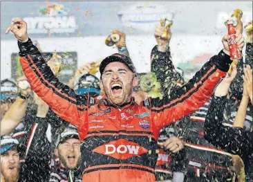  ?? [CHUCK BURTON/THE ASSOCIATED PRESS] ?? Austin Dillon celebrates in victory lane after winning the Daytona 500 on Sunday at Daytona Internatio­nal Speedway.