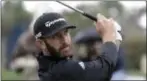  ?? LYNNE SLADKY — THE ASSOCIATED PRESS ?? Dustin Johnson plays his shot from the third tee during the final round of The Players Championsh­ip golf tournament in Ponte Vedra Beach, Fla.