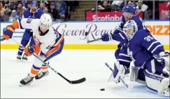  ?? CANADIAN PRESS PHOTO ?? New York Islanders’ Pierre Engvall scores on Toronto Maple Leafs goaltender Ilya Samsonov during third period NHL hockey action in Toronto on Monday.