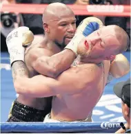  ??  ?? UNDISPUTED CHAMP: Mayweather defeating Mcgregor