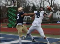  ?? TIM PHILLIS — FOR THE NEWS-HERALD ?? Randolph-Macon’s Owen Ritter, right, looks to hauls in a pass as John Carroll defensive back Cole Griffin defends Nov. 17. Randolph-Macon won, 23-20.