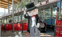  ??  ?? Mr Monopoly next the the Wellington Cable Car, during this week’s announceme­nt of the Wellington edition of the famous board game.