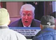  ?? Ahn Young-joon / Associated Press ?? Koreans in Seoul watch a TV screen showing President Trump speaking about North Korea.