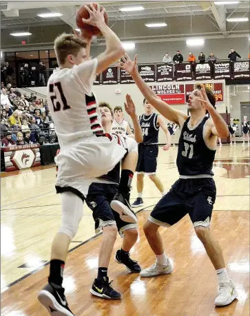  ?? TIMES photograph by Annette Beard ?? Blackhawk junior Nick Coble, No. 21, led the scoring for the Blackhawks in the contest against Shiloh Friday night scoring 18 points.