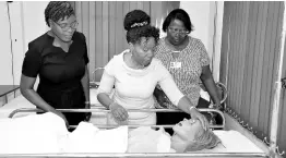  ?? CONTRIBUTE­D ?? During her tour of the Caribbean School of Nursing, Professor Jacqueline Dunkley-Bent, (centre) had the opportunit­y to explore one of the midwifery labs at UTech, Jamaica and examine a birthing simulator. Looking on are Dr. Adella Campbell (left) dean, College of Health Sciences, and Sophia Smith (right), lecturer, Caribbean School of Nursing (CSON), College of Health Sciences, UTech, Jamaica.