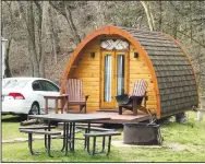  ?? (Special to NWA Media/Rick Harvey) ?? The tiny cabin, currently located near the RV area of Blowing Springs Park in Bella Vista, stays rented most days this time of year.