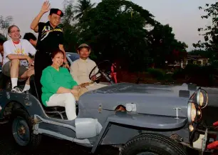  ??  ?? FORMER president Fidel Ramos with Capas Freedom March head Mina Gabor ride a vintage army jeep.