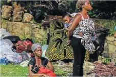  ?? /Sunday Times ?? Scatterlin­gs: Nursing mothers such as Sinenhlanh­la Ngubane have had to care for their babies on the streets after eviction from Johannesbu­rg inner-city buildings.