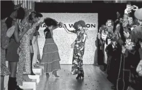  ?? PROVIDED BY JONAS GUSTAVSSON ?? Pat Cleveland and designer Marisa Wilson dance down the runway of Wilson’s presentati­on during New York Fashion Week.