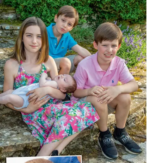  ??  ?? Ella, 11, Theodore-Alexander, six, and MaxwellRob­in, eight, show their love for the new member of the family, celebratin­g his birth with a blueberry and vanilla cake (below)