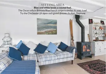  ??  ?? SITTING AREA Blue and white lends a coastal feel. the oscar sofa in brittany blue French stripe is similar, £2,445, Loaf. try the chichester 5ft open rack grand dresser, £2,690, Neptune