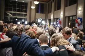  ?? AUDRA MELTON, NYT ?? Above, supporters of Roy Moore, the Republican candidate for U.S. Senate, pray at an election night gathering in Montgomery, Ala., on Dec. 12. The sight of white evangelica­l voters giving overwhelmi­ng support to Moore has troubled many conservati­ve...