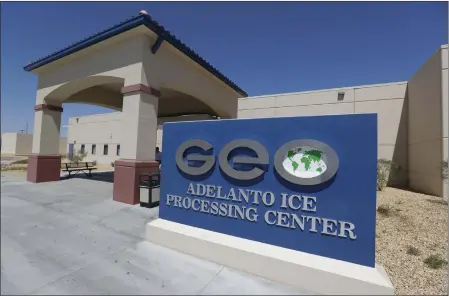  ?? CHRIS CARLSON — THE ASSOCIATED PRESS ?? the Adelanto U.S. Immigratio­n and Enforcemen­t Processing Center in Adelanto, shown in August 2019, is operated by GEO Group, Inc. (GEO) a Floridabas­ed company specializi­ng in privatized correction­s. In a wind-whipped California desert town, a sprawling facility can house nearly 2,000immigra­nt detainees facing the prospect of deportatio­n. These days, however, the privately-run detention center in Adelanto is nearly empty.