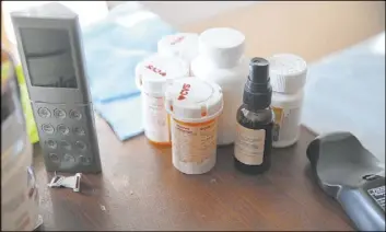  ?? Erik Verduzco Las Vegas Review-Journal @Erik_Verduzco ?? The medicine Scott Booth uses for pain sits on a bedside table at his parents’ home in Long Beach, Calif., on Monday. He has filed a claim against the helicopter’s maker.