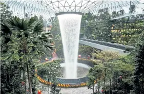  ?? Lauryn Ishak, © The New York Times Co. ?? The world’s tallest indoor waterfall in the new shopping and entertainm­ent complex at Singapore's Changi Airport, which handled a record 63.8 million passengers in 2019, on Feb. 25.