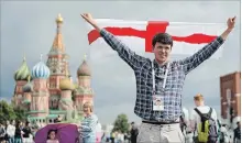  ?? CHRISTOPHE­R FURLONG GETTY IMAGES ?? England fan Peter Rogers poses for a photo in Red Square ahead of the World Cup semifinal between England and Croatia in Moscow.