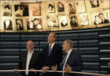  ?? DEBBIE HILL — POOL PHOTO VIA AP ?? Britain’s Prince William visits the Hall of Names at the Yad Vashem Holocaust Memorial Tuesday in Jerusalem.