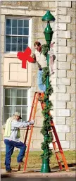  ?? Janelle Jessen/Herald-Leader file photo ?? City crews work on Mount Olive Street preparing downtown for Christmas in November of 2016.