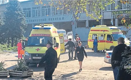  ??  ?? SHOOTING: Emergency services at Kerch Polytechni­c College in the Crimean city of Kerch, where a student gunman went on the rampage