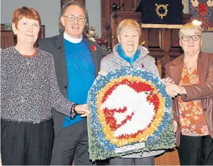  ??  ?? Church elders Muriel McGregor, Martha Arnott and Elizabeth Mitchell with the Rev Donald Lawrie and the dove artwork.