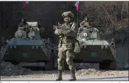  ?? (AP/Dmitry Lovetsky) ?? Russian peacekeepe­rs patrol Saturday in an area near the Dadivank, an Armenian Apostolic Church monastery in the separatist region of Nagorno-Karabakh. More photos at arkansason­line. com/1115nagorn­o/.