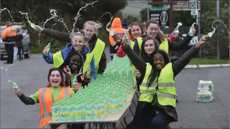  ??  ?? Volunteers manned the watering stations for the Dingle Marathon at the weekend. Pic: Dominick Walsh