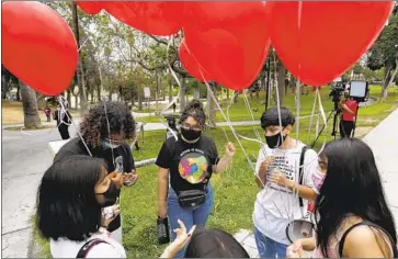  ?? Luis Sinco Los Angeles Times ?? “DREAMERS” and backers meet at MacArthur Park last week to celebrate the court’s rejection of President Trump’s attempt to undo DACA, which protects thousands of immigrants brought to the U.S. as children.