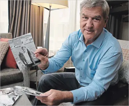  ?? COURTESY OF KELSEY WILSON ?? Bobby Orr looks through photos from the Toronto Star archives during an interview for his new book, “Bobby: My Life in Pictures.”